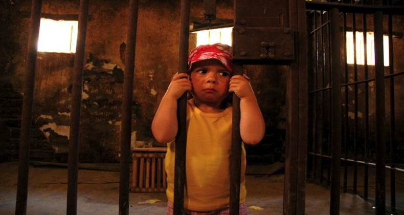 baby behind prison bars