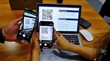 using a phone to scan a qr code on a phone