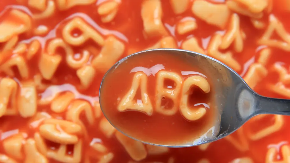 Spaghetti letters with three letters in a spoon