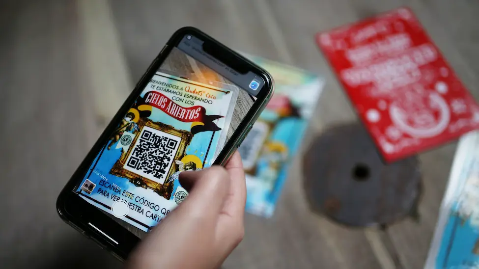 mobile phone scanning the qr code on a flyer