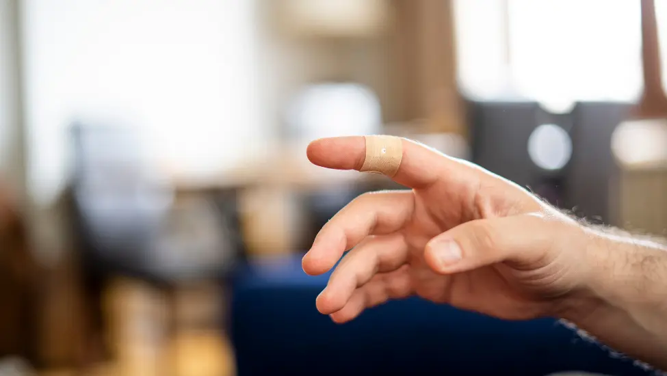 finger with a band aid sticking plaster
