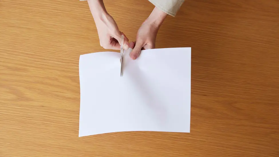 Cutting paper into two parts