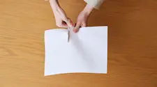 Cutting paper into two parts